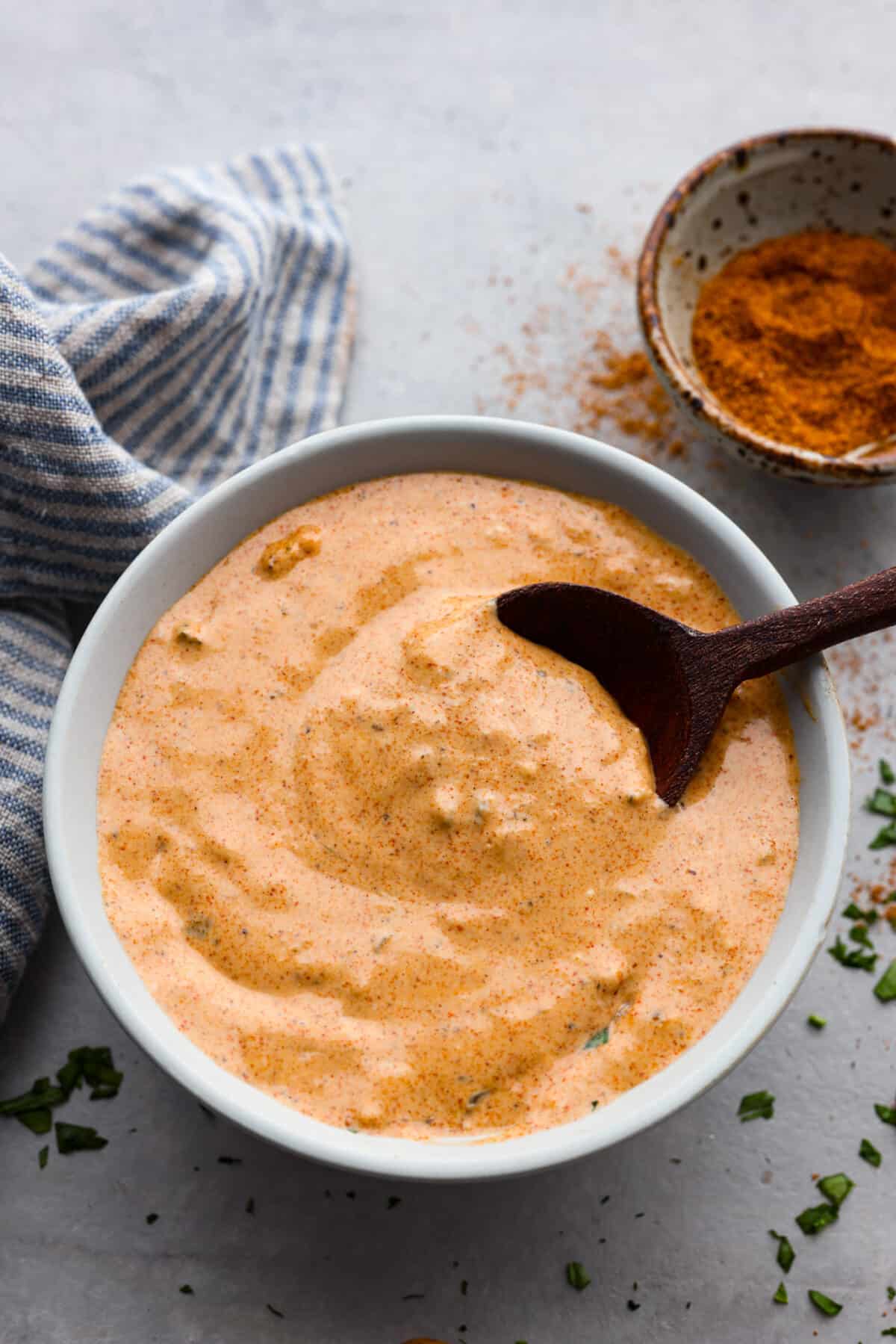 Top-down view of remoulade sauce in a white bowl.
