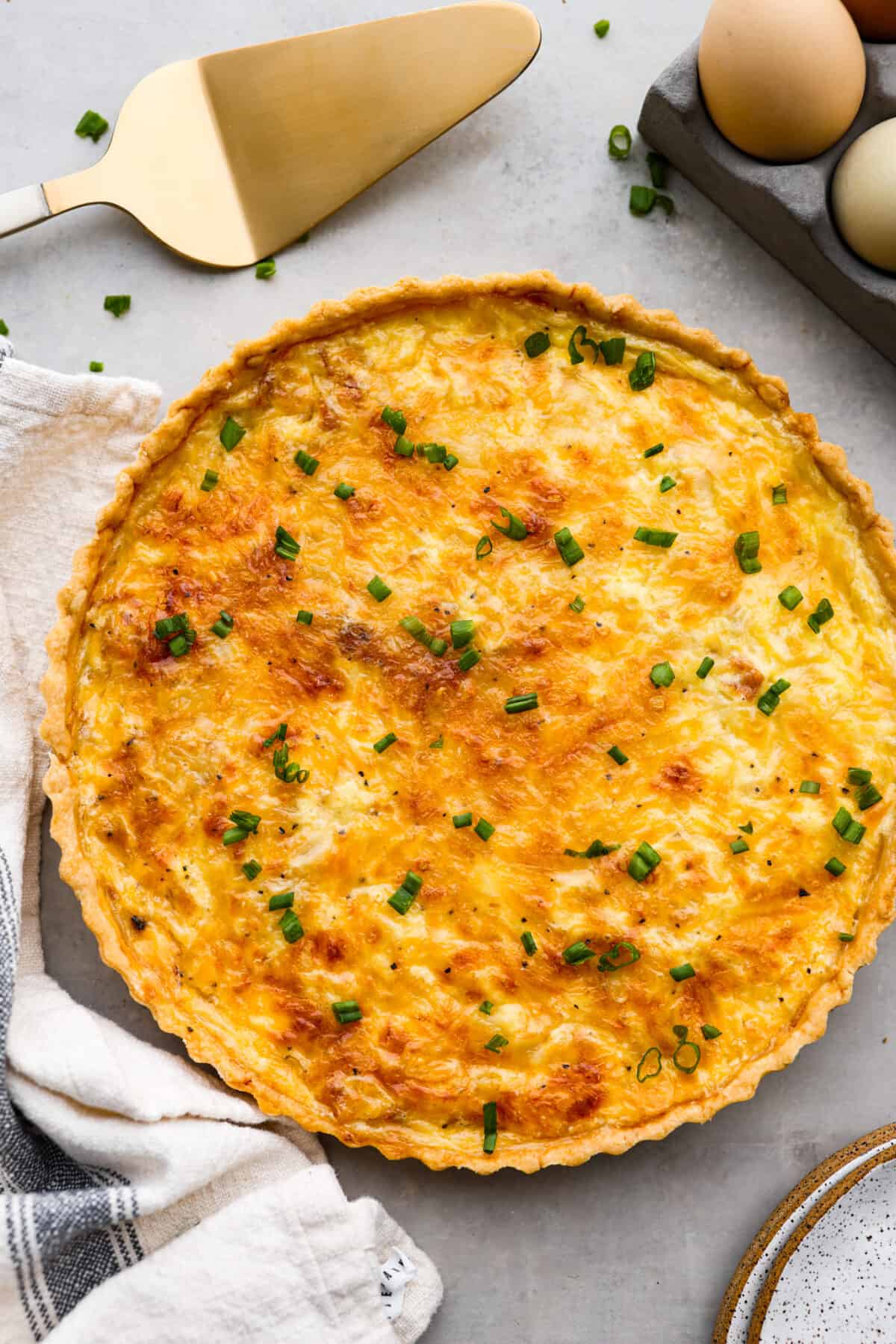 Top-down view of a whole quiche lorraine.