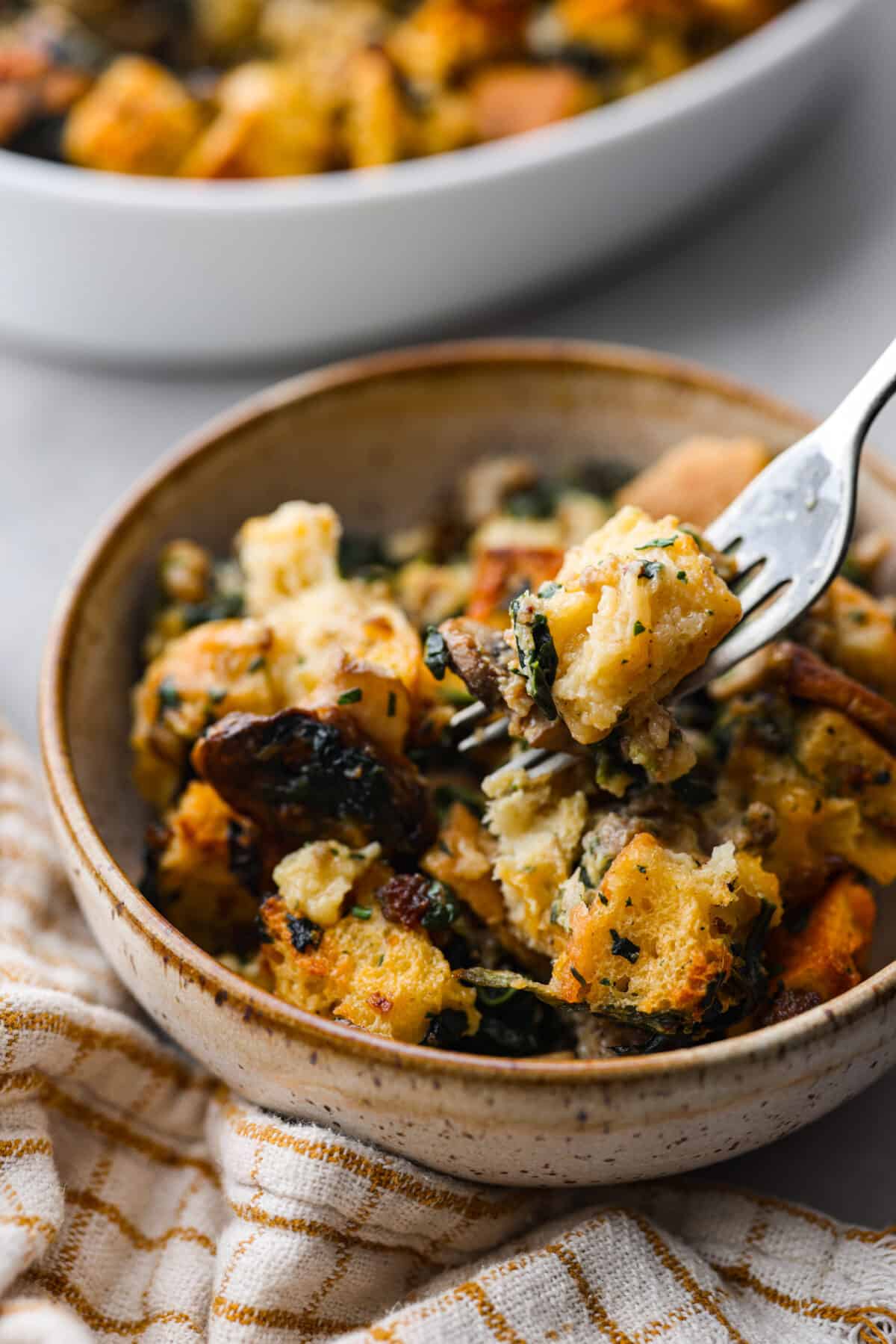 Angle shot of plated breakfast strata in a bowl. 