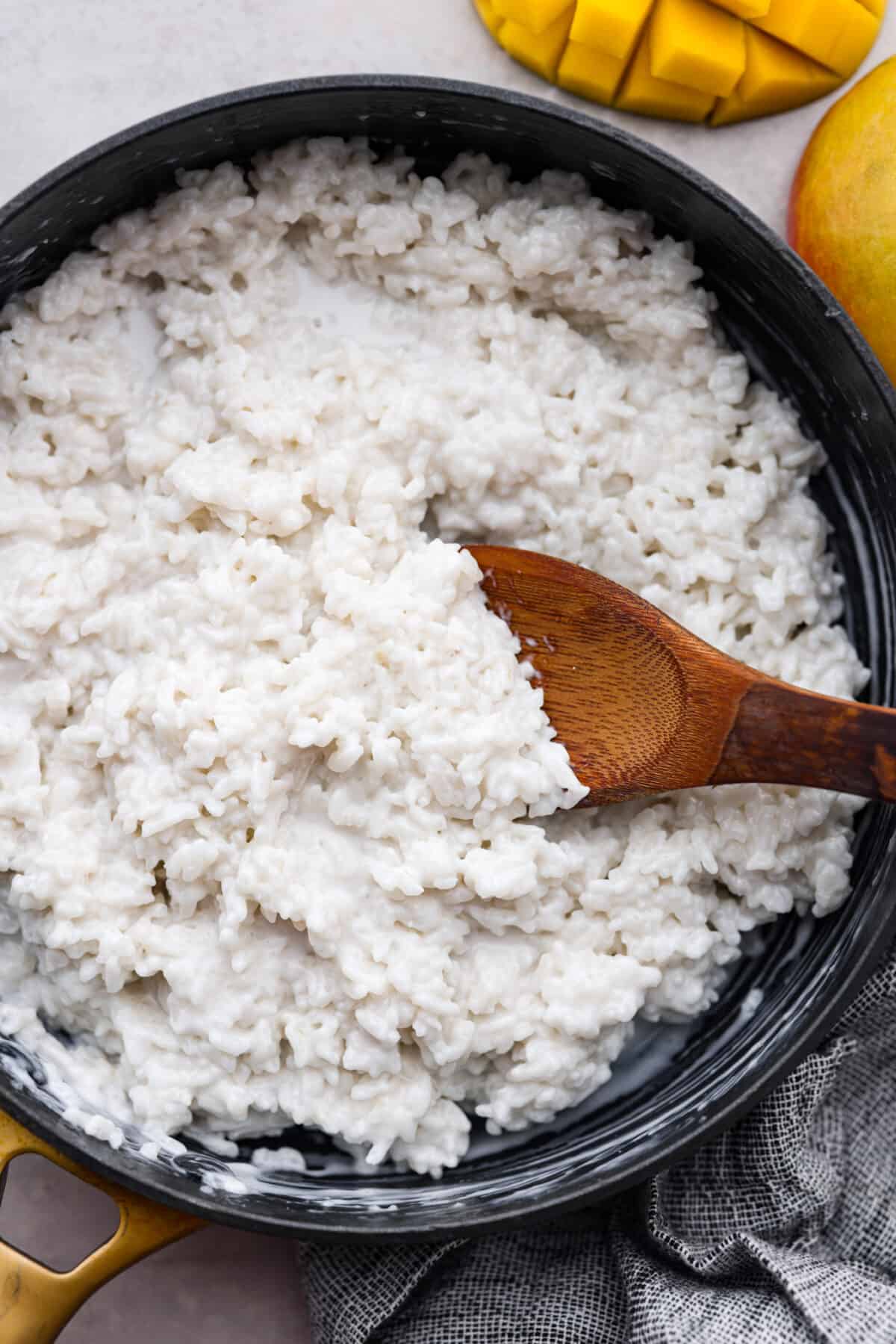 Closeup of the sticky rice in a black pan.