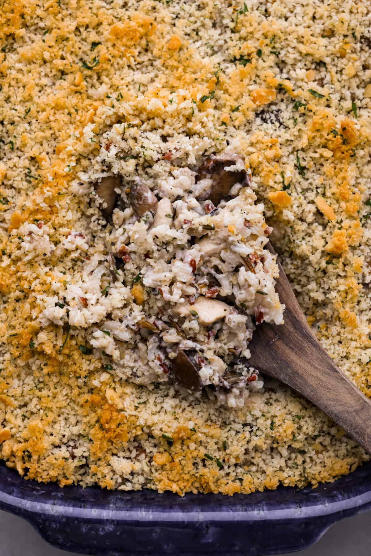 Closeup of a scoop of chicken and wild rice casserole.