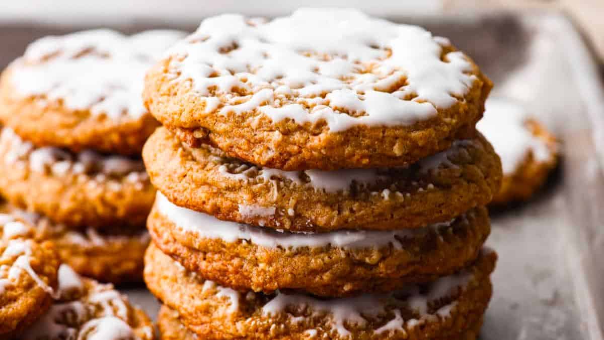 A stack of iced oatmeal cookies. 