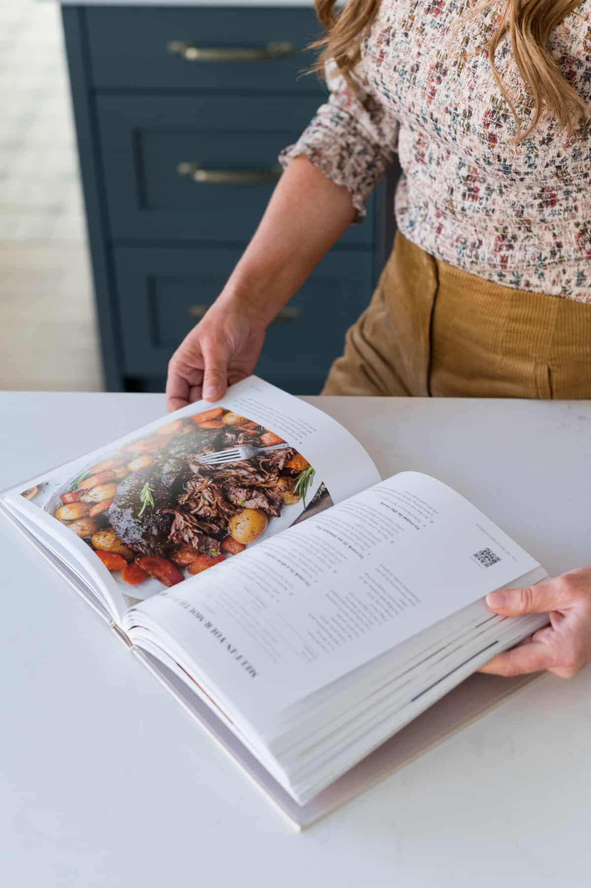 The Tried and True Cookbook on the table, open to a recipe. 