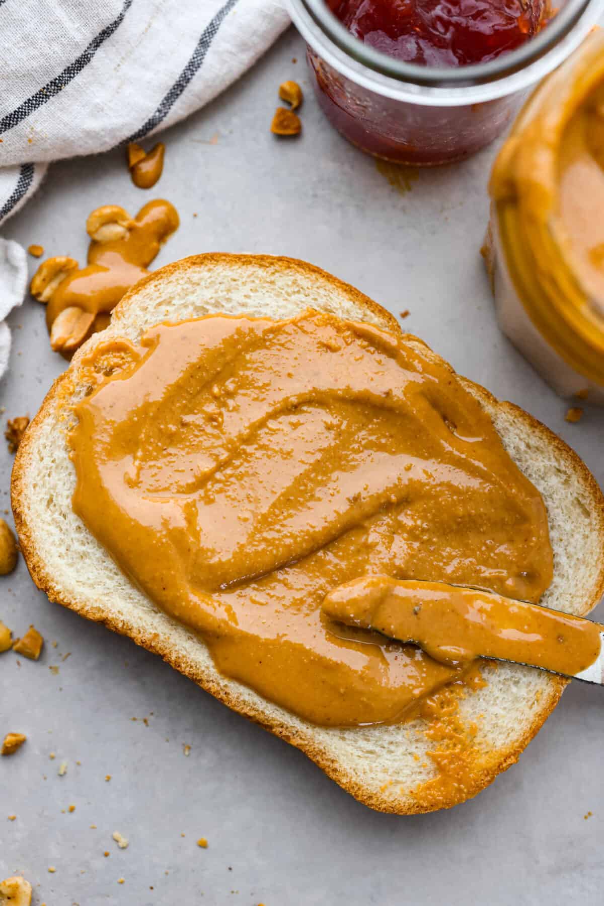 Peanut butter spread over a piece of bread.