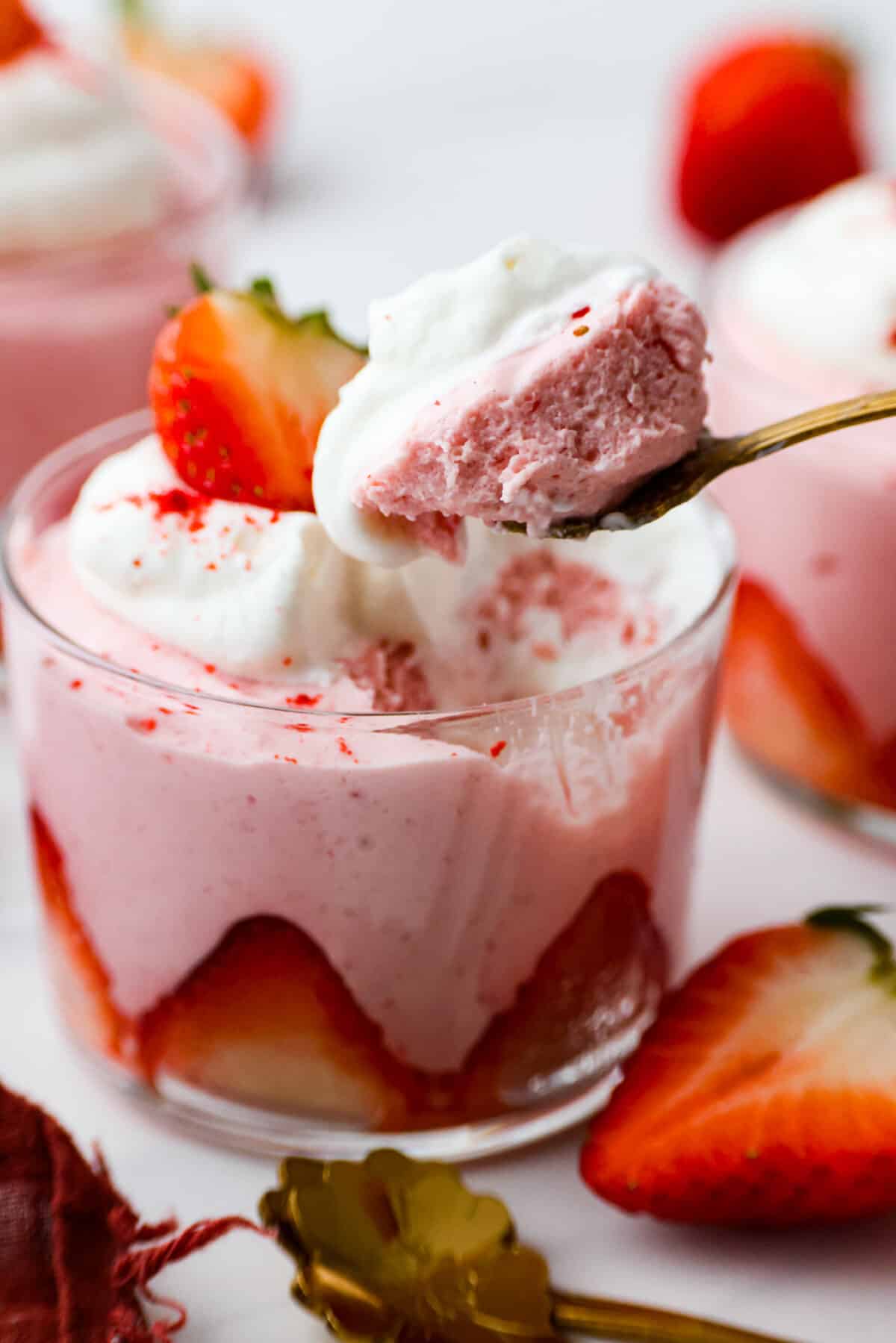 Taking a bite of strawberry mousse.