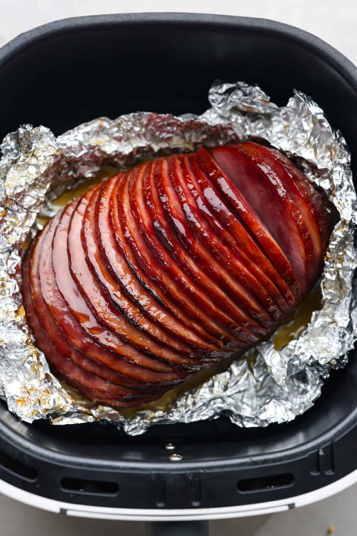 Sliced ham in an air fryer.