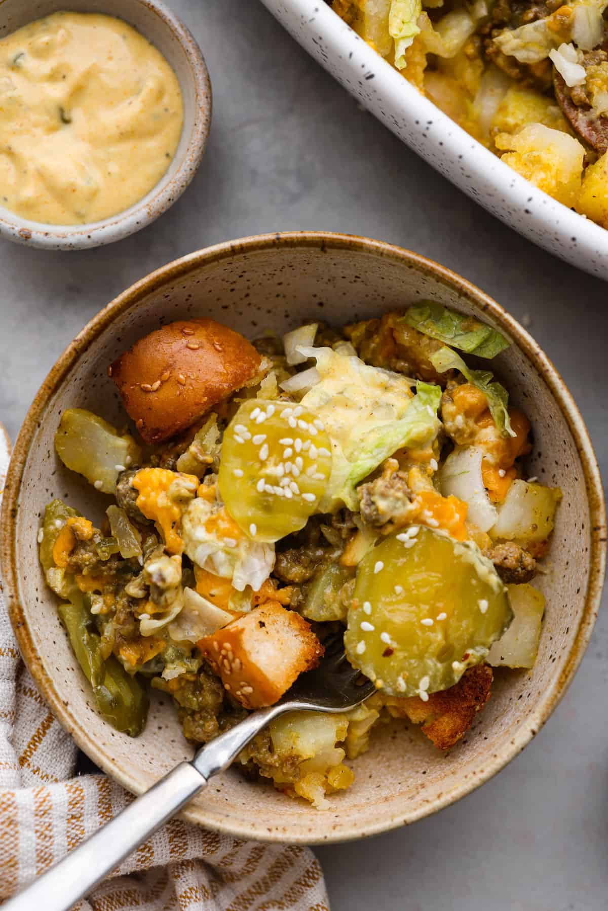 Meaty, cheesy, and chock full of tasty mix-ins like hash browns, pickles, and onions, Big Mac casserole is the perfect dinner to make this week! It’s an easy, deconstructed version of the classic burger we all know and love. A serving of Big Mac casserole.