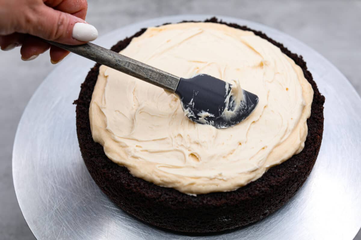 Adding the cream layer to the cake