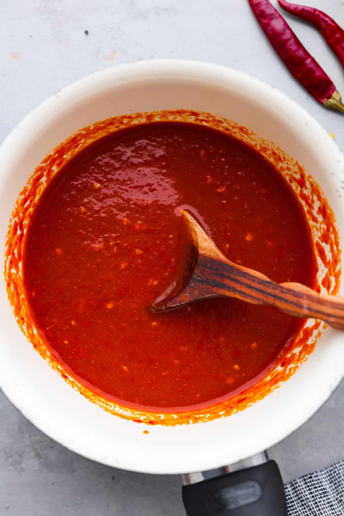 Hot sauce in a white bowl.