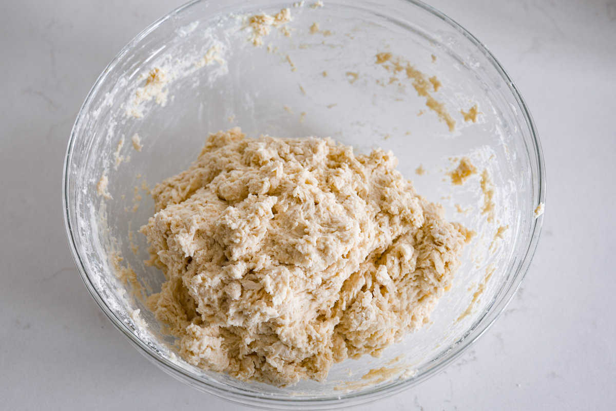This Irish soda bread recipe uses just 4 pantry staples for a warm, crusty loaf that's perfect for slathering with butter and jam, or soaking up your favorite soup. No kneading required! The dough after being mixed together.
