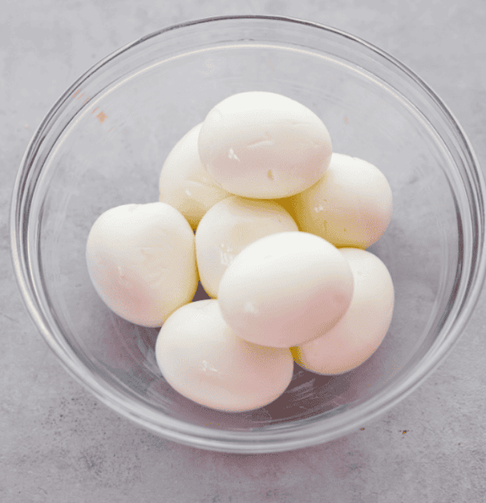 A glass bowl with boiled eggs 