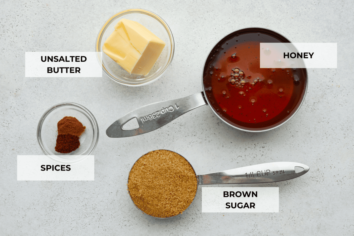 The necessary ingredients for the glaze: butter, honey, cinnamon and cloves, and brown sugar.