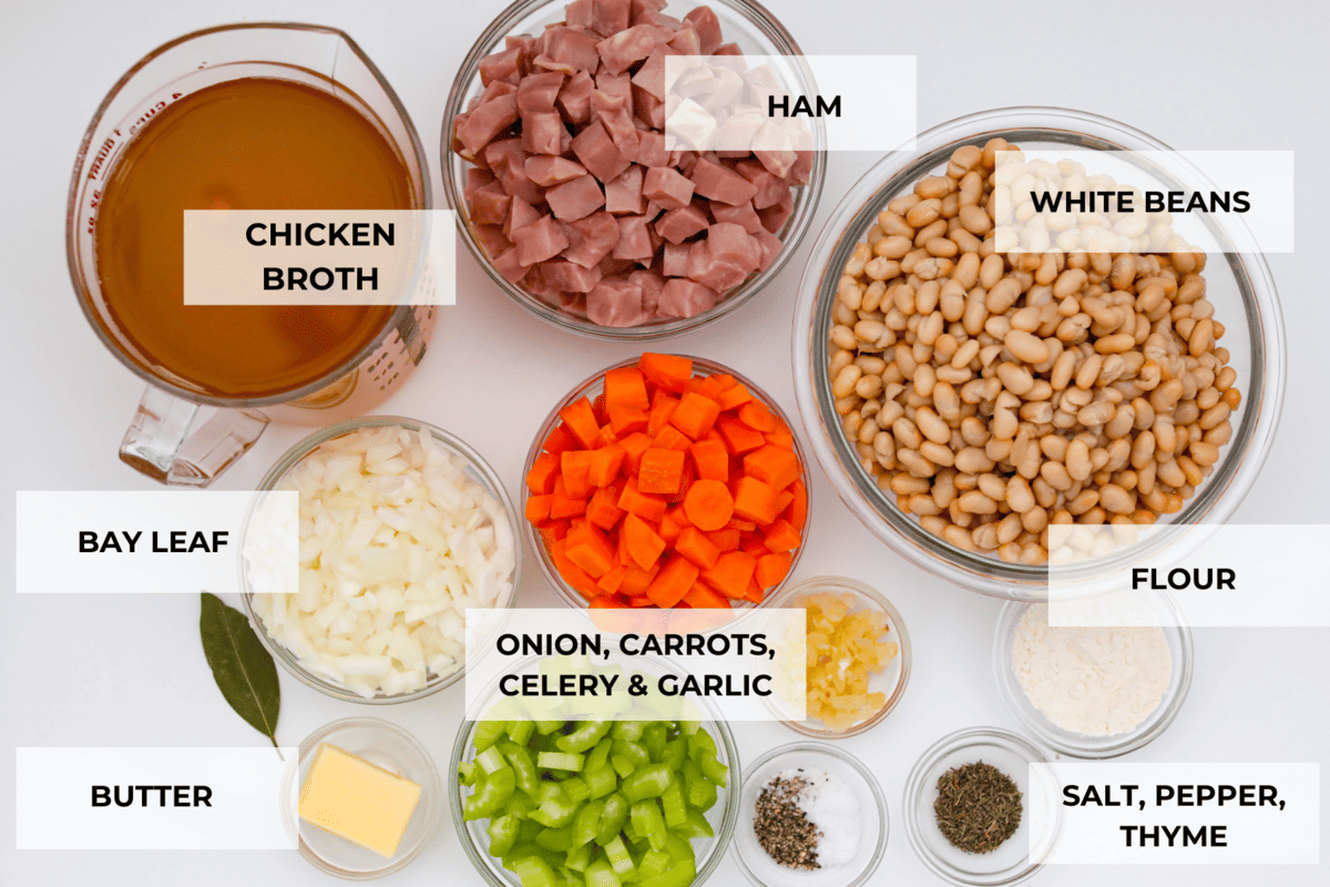 Comforting ham and bean soup is a classic and hearty soup. It's loaded with creamy white beans, smoky ham, and tender veggies. It's the perfect soup for using up your leftover ham and super easy to make on those busy weeknights. Ingredients for the ham and bean soup recipe labeled.