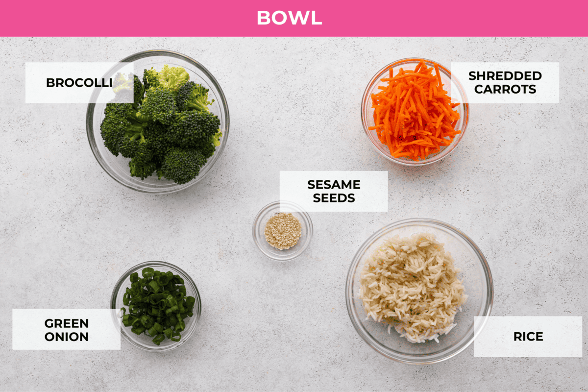 Say hello to your new favorite lunch: this honey-glazed salmon bowl made with juicy air fryer salmon bites, broccoli, and shredded carrots over white rice! Ingredients to assemble the bowls with. Listed are: broccoli, shredded carrots, sesame seeds, green onion, and rice