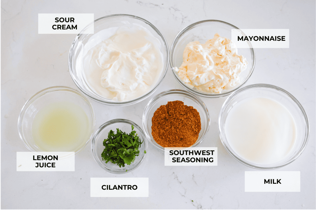 All of the dressing ingredients, separated into small glass bowls.