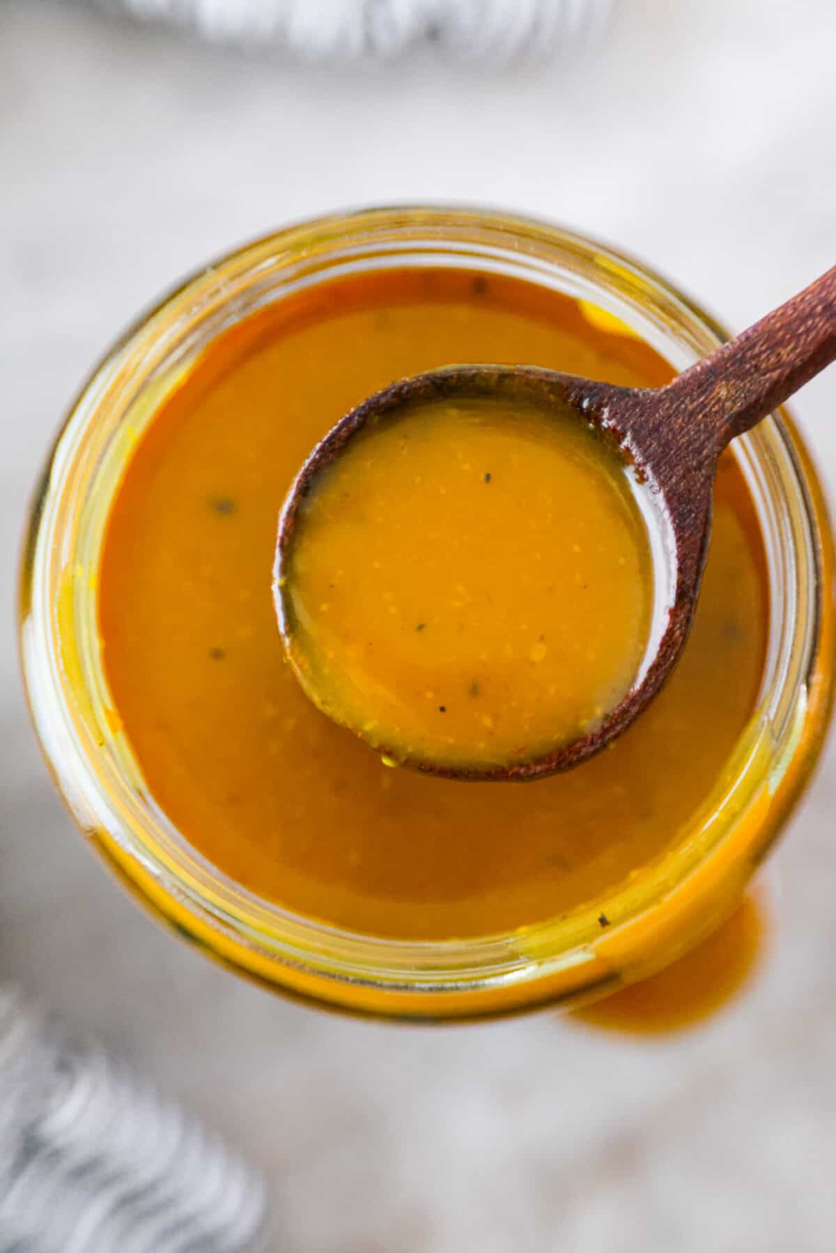 Top-down, closeup shot of mustard bbq sauce.