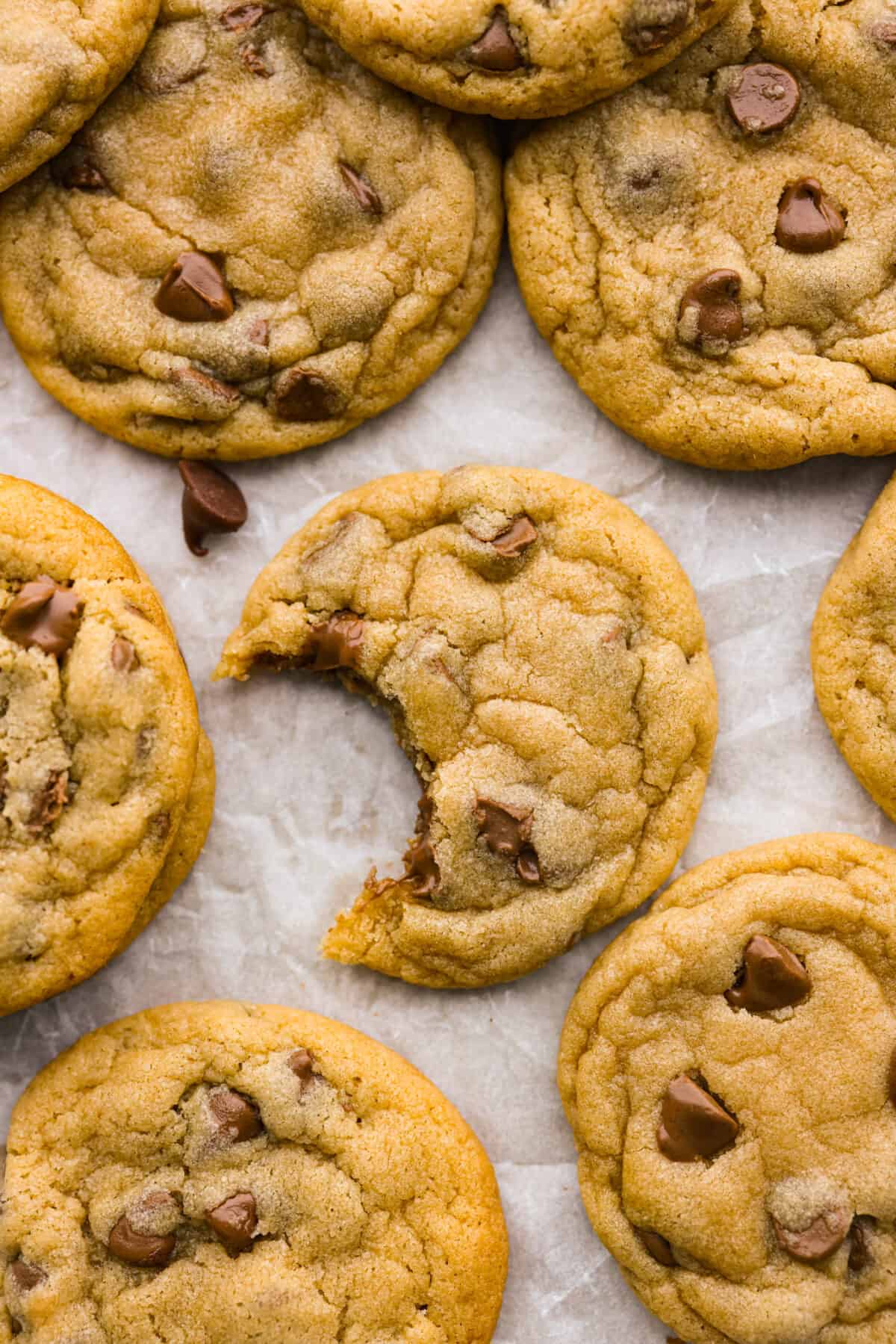 Top view of chocolate chip pudding cookies with a bite out of one of them.