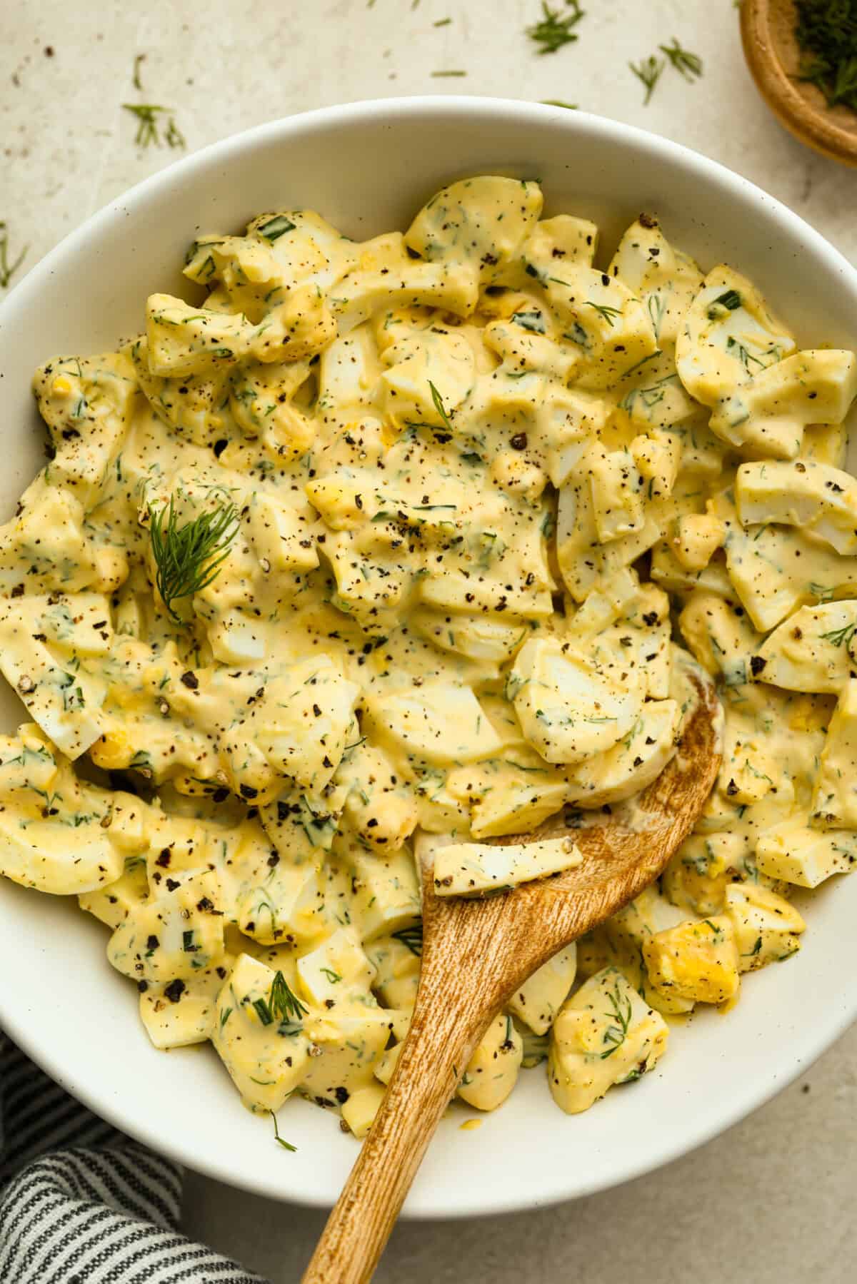 Egg salad in a white bowl. 