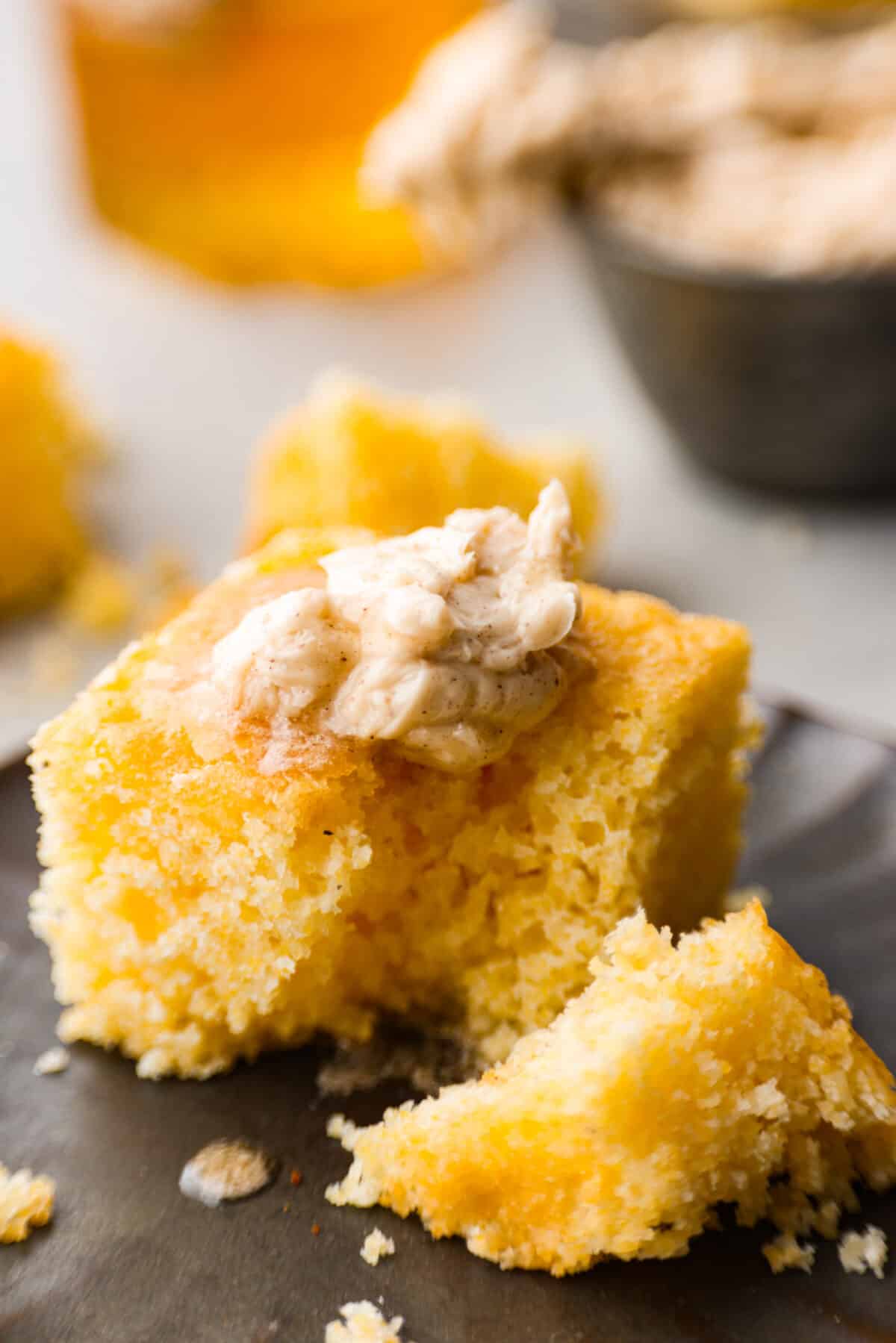 A square of cornbread topped with a dollop of the sweet spread.