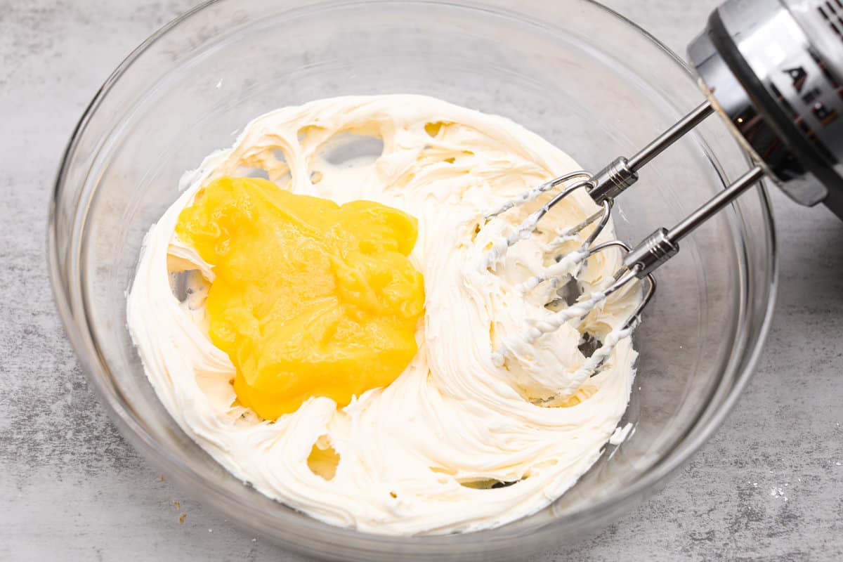 Meet lemon tiramisu! The most amazing citrusy twist on a classic Italian dessert. The layers of mascarpone cream and lemon curd will have you reaching for another slice! Whipping the heavy cream.
