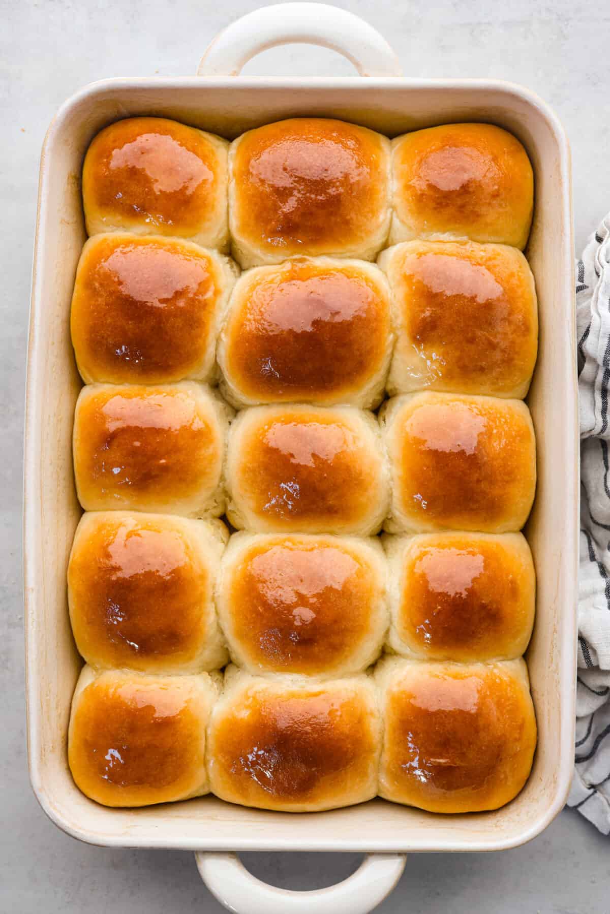 Top view of perfect soft and buttery rolls baked in a baking dish.