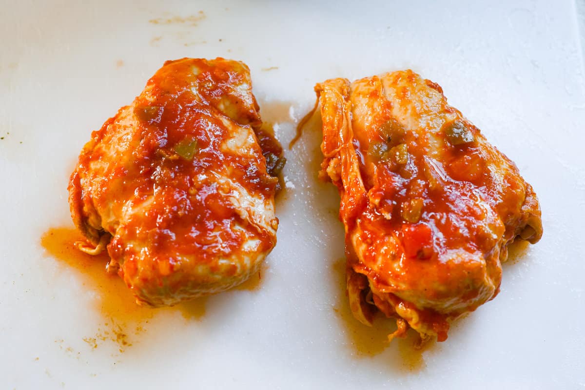 Weeknight dinner made easy with this crockpot salsa chicken! Tender flavorful chicken that only takes 5 ingredients to make. It's a versatile recipe the whole family will love! Chicken cooked and ready to shred.