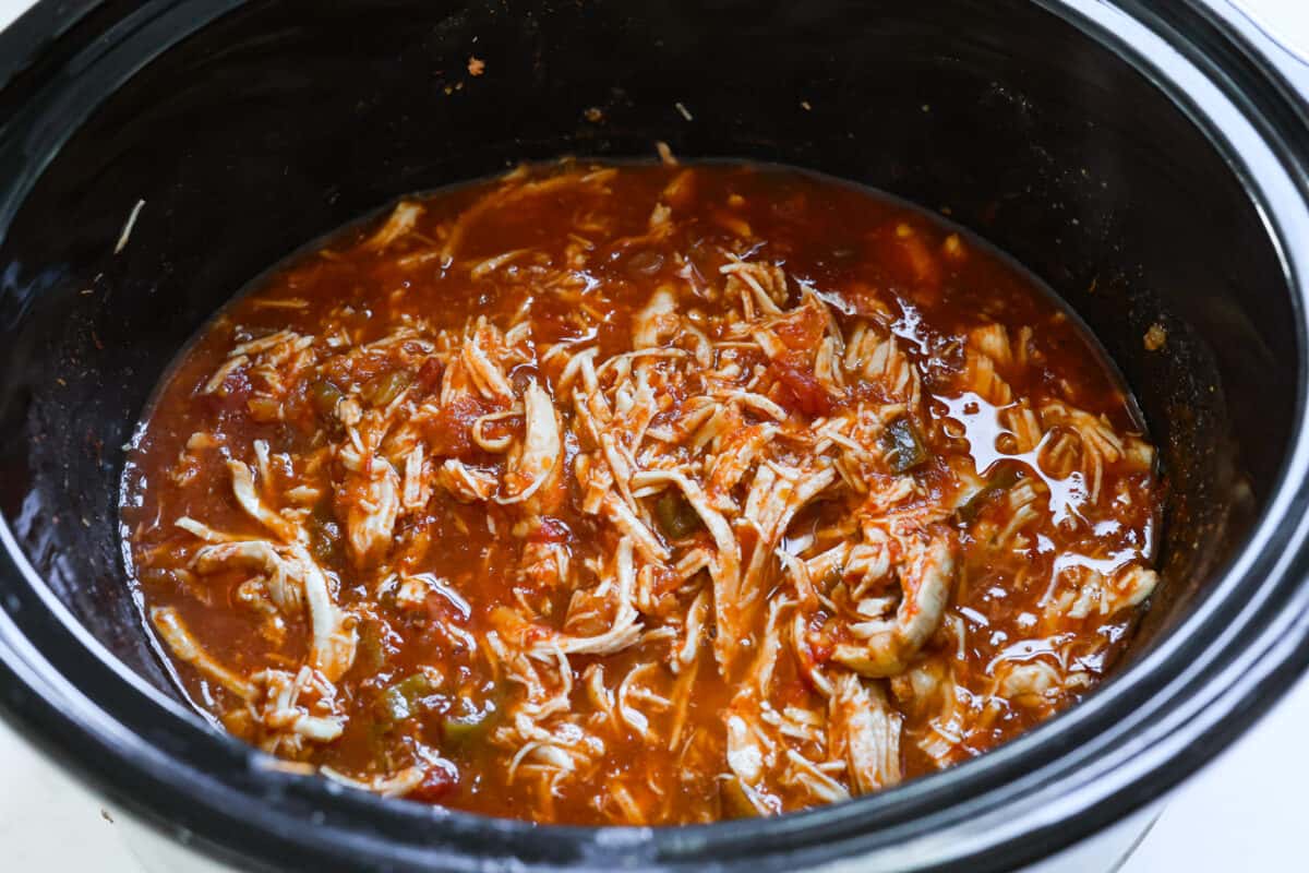 Shredded chicken added back to the slow cooker.