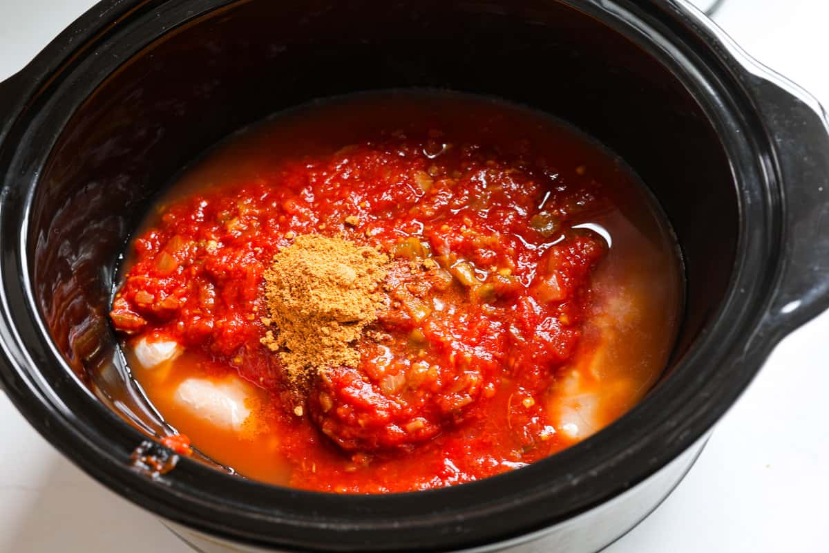 Weeknight dinner made easy with this crockpot salsa chicken! Tender flavorful chicken that only takes 5 ingredients to make. It's a versatile recipe the whole family will love! Ingredients added to the slow cooker.