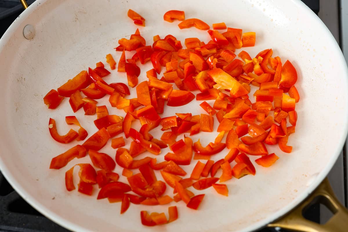 Sheet pan eggs are not only fluffy and full of flavor, but the best way to meal prep eggs or feed a crowd! Add your favorite mix-ins and serve as-is or use them to make breakfast sandwiches or as a topping for avocado toast! Sautéing the peppers