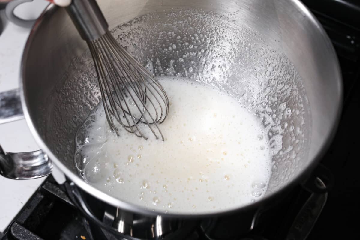 Whisking the egg whites and sugar together.