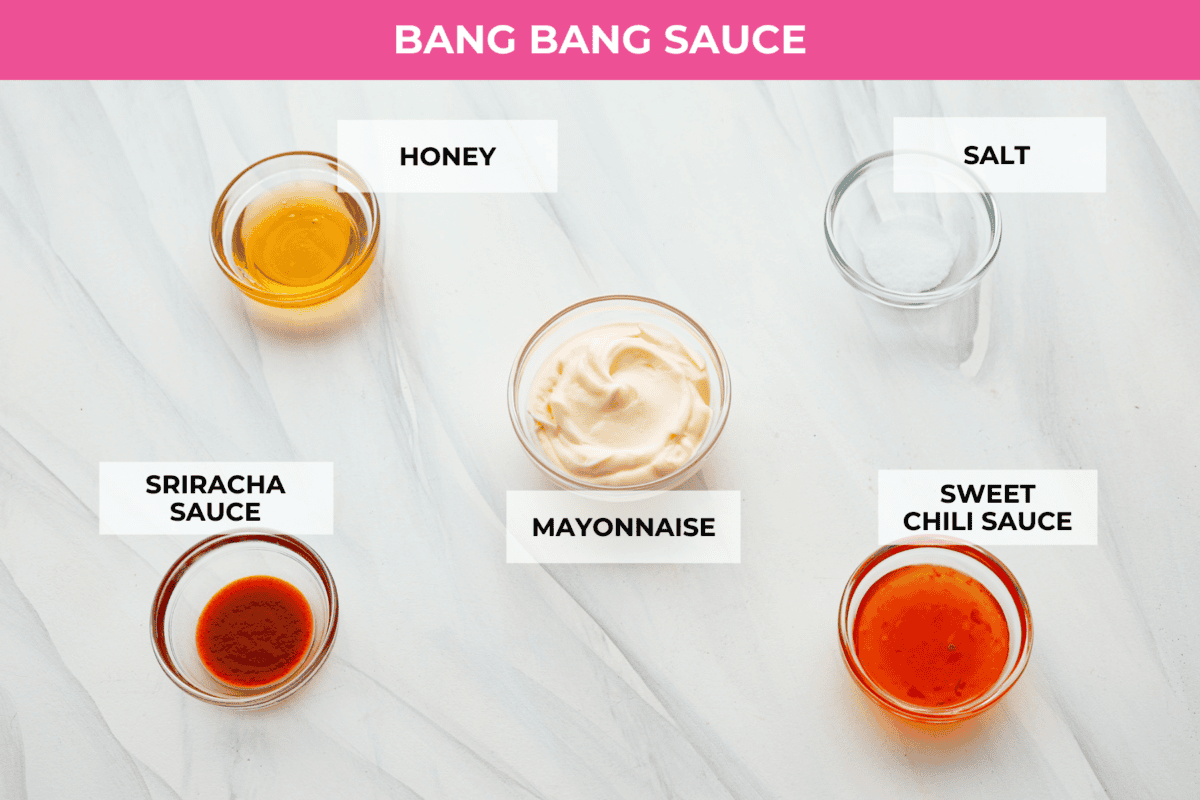 Ingredients on the counter in separate bowls to make bang bang sauce. 