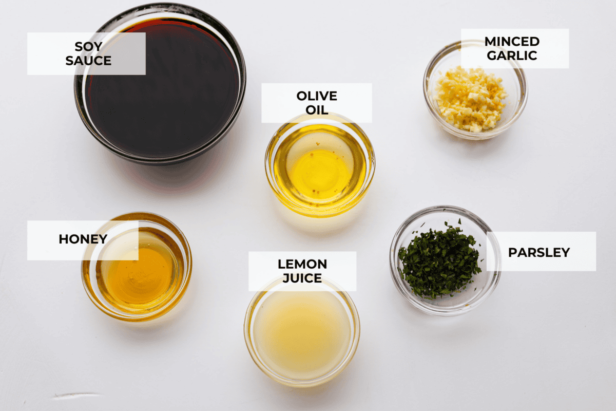 The top view of ingredients in glass bowls and individually labeled. 