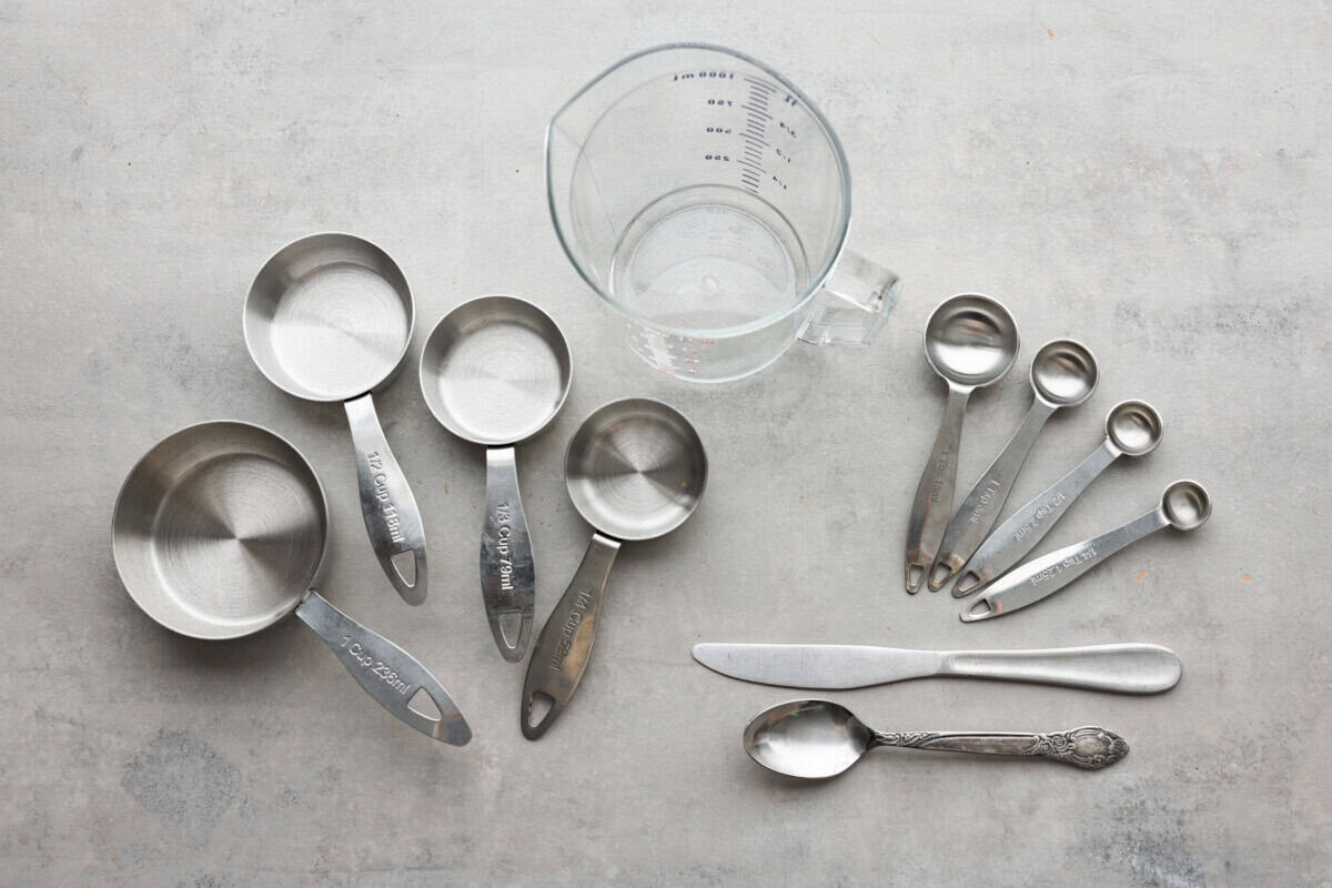 Measuring cups and spoons laid out on the counter. 