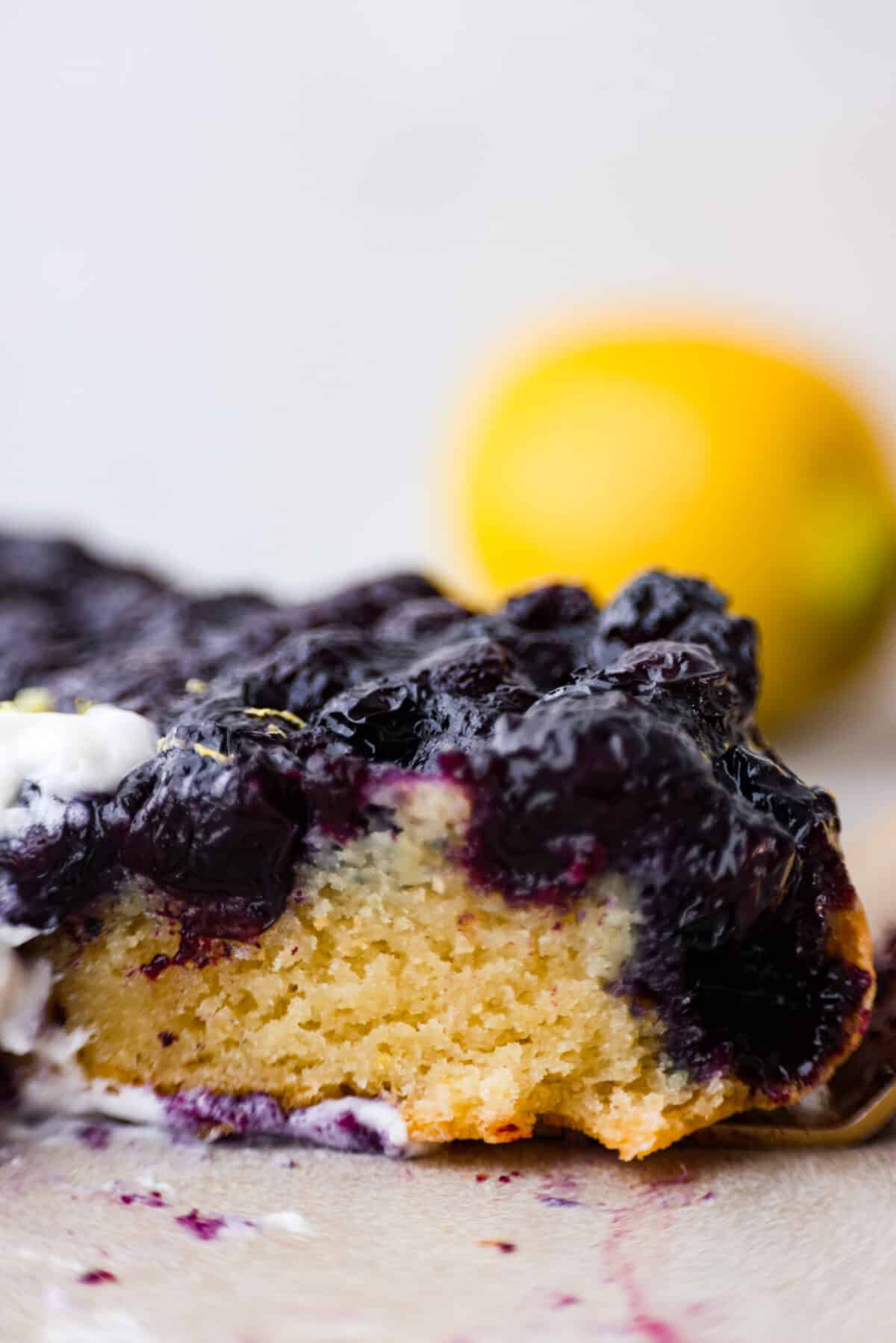 Close view of a slice of blueberry lemon upside-down cake.