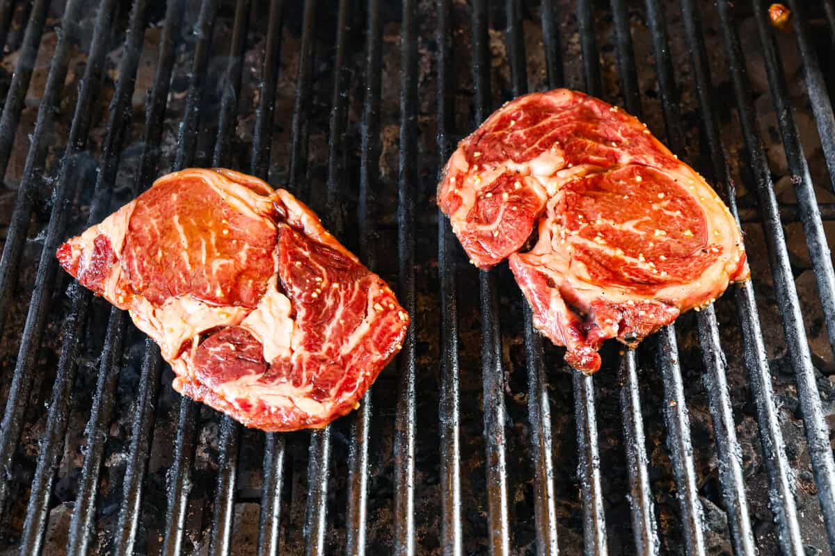 Fire up the grill for these mouthwatering Grilled Bourbon Steaks! Marinated in a blend of whiskey, brown sugar, and savory spices, these steaks are sure to be a hit at your next barbecue. Raw meat added to the grill.