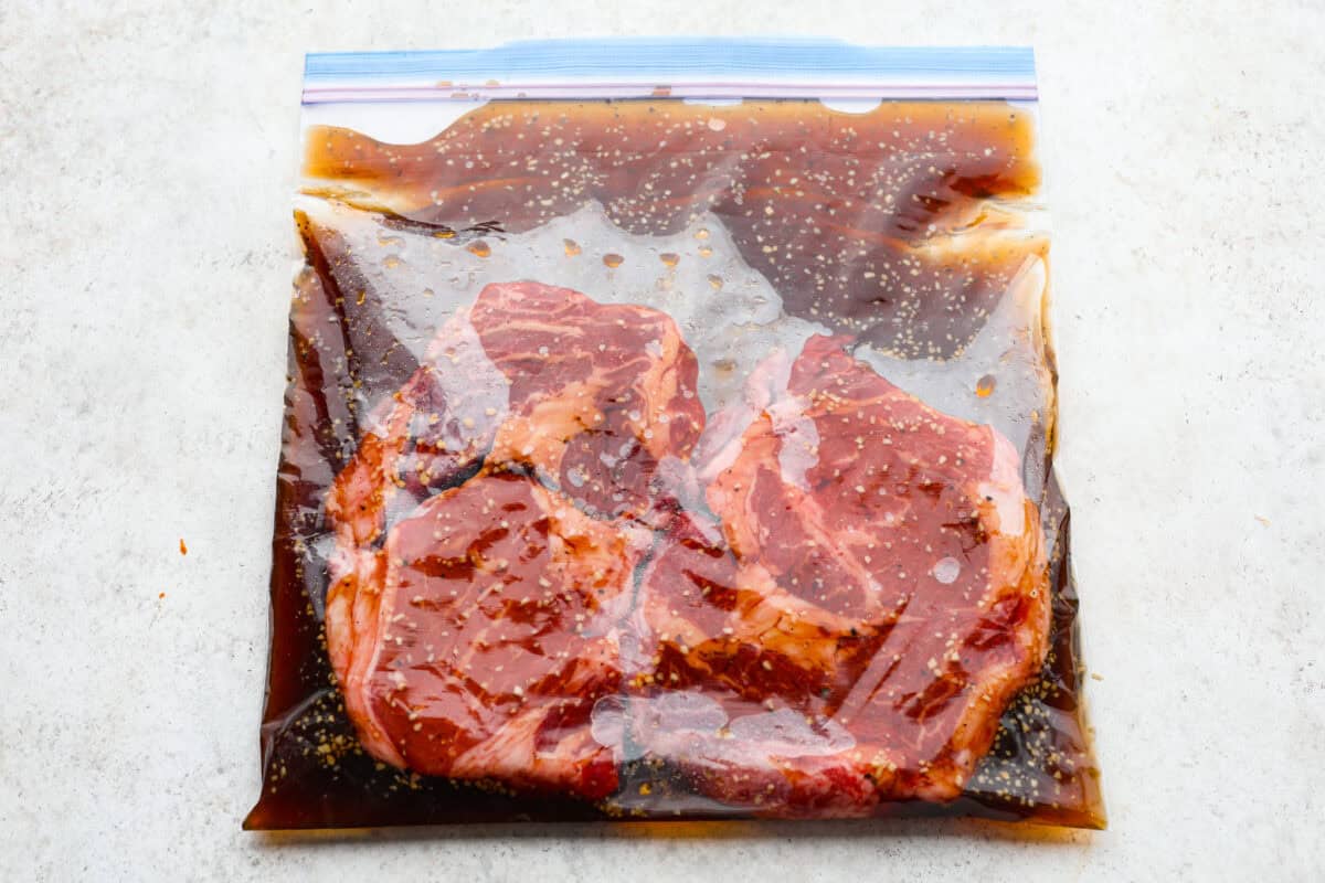 Steak added to the marinade in a ziplock bag. 