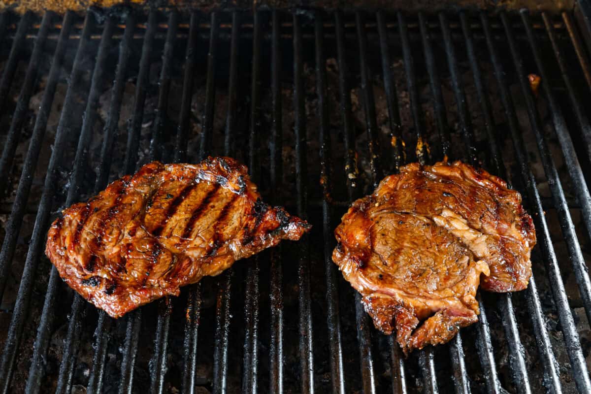 Bourbon steak being cooked on the grill. 