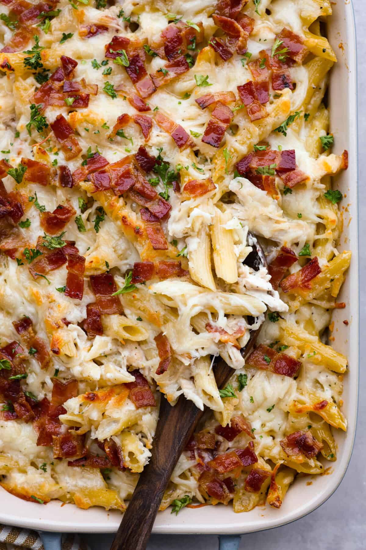 A close up of cooked chicken bacon ranch casserole. 