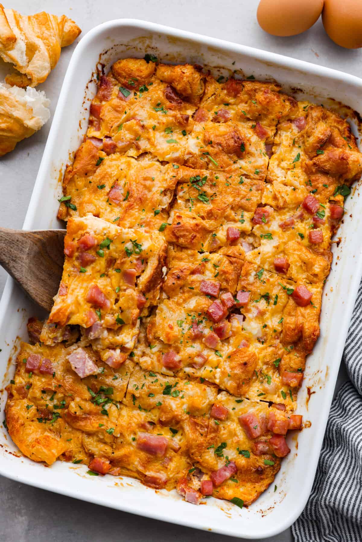 The top view of a ham and cheese croissant casserole. 