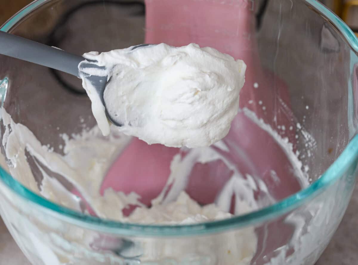 Sixth photo of the whipped cream mixed in a stand mixer.