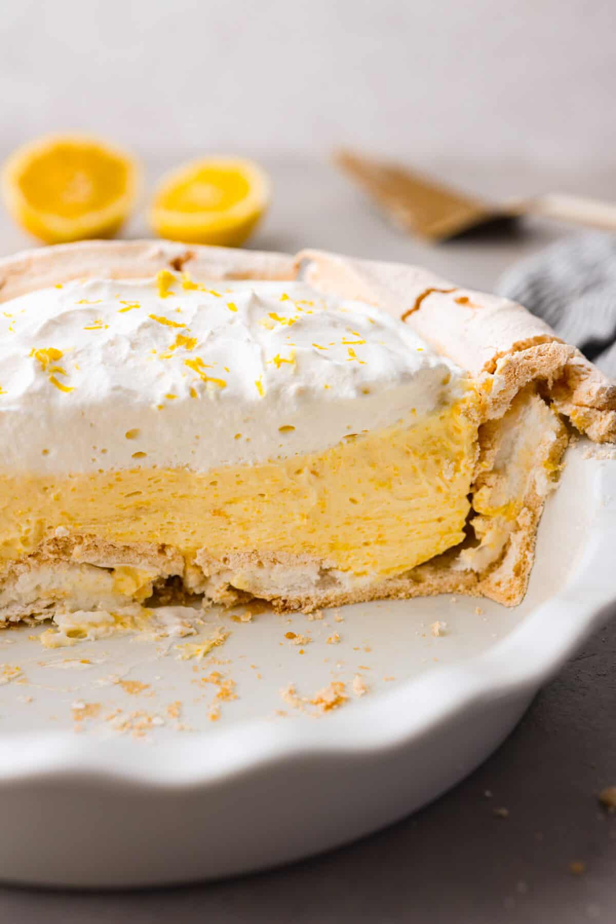 Close view of the sliced lemon angel pie in the pie dish.