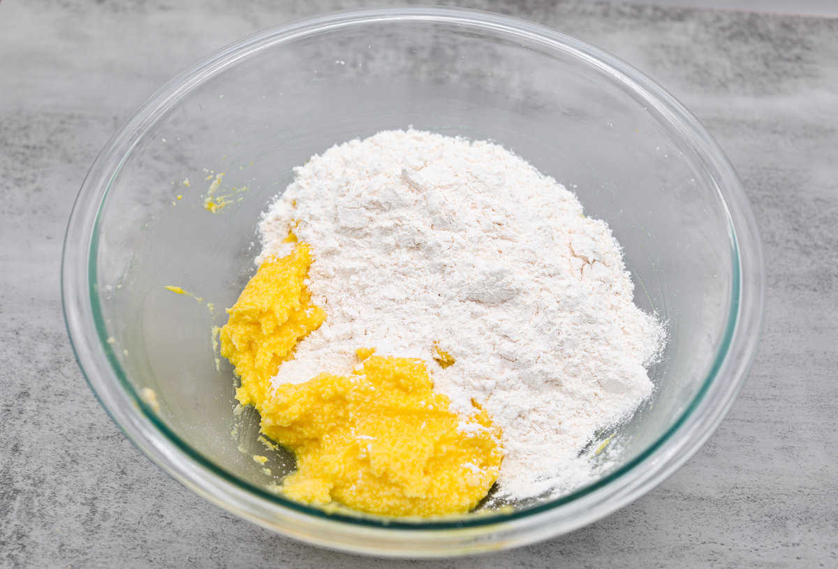 Lemon crinkle cookies are thick, soft pillows of lemon deliciousness! They have a refreshing flavor with an irresistible chewy texture. The perfect balance of sweet and tart make these a welcome treat for any occasion! Mixing the batter together for the lemon crinkle cookies