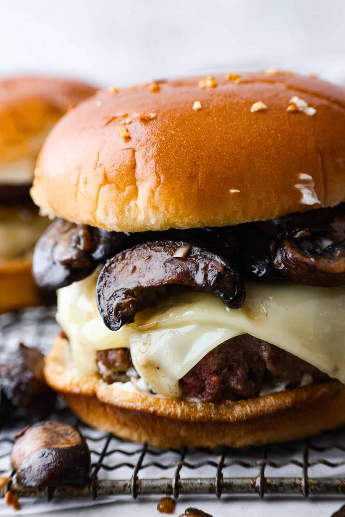 A closeup of a mushroom Swiss burger. 