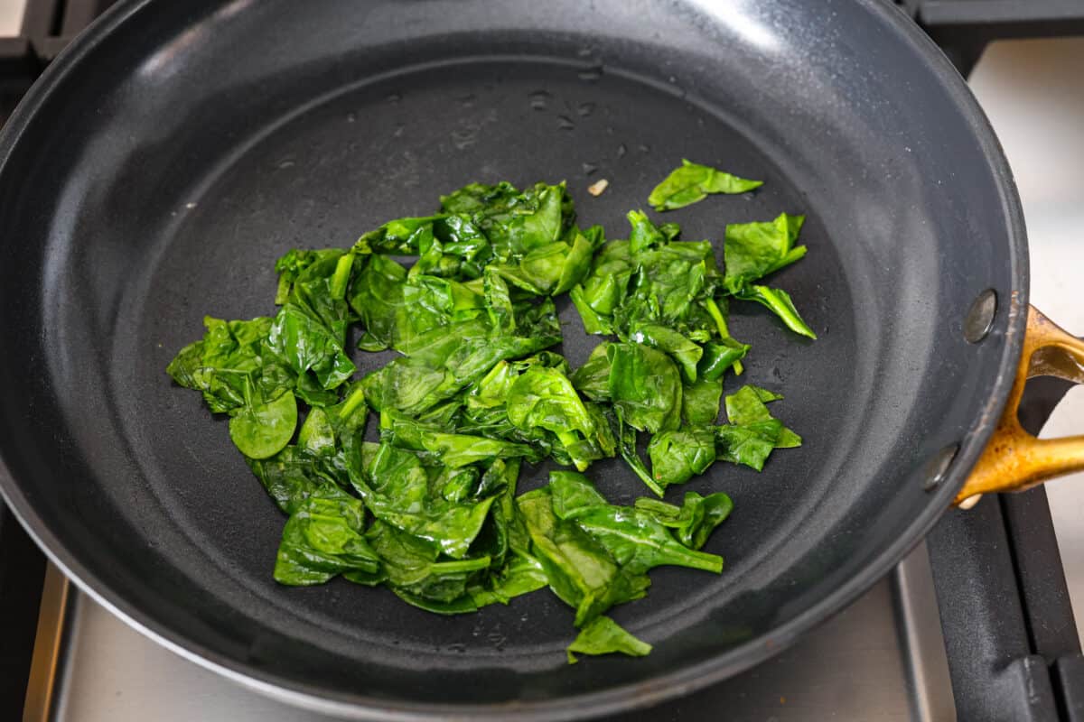 Wilted spinach in a pan. 