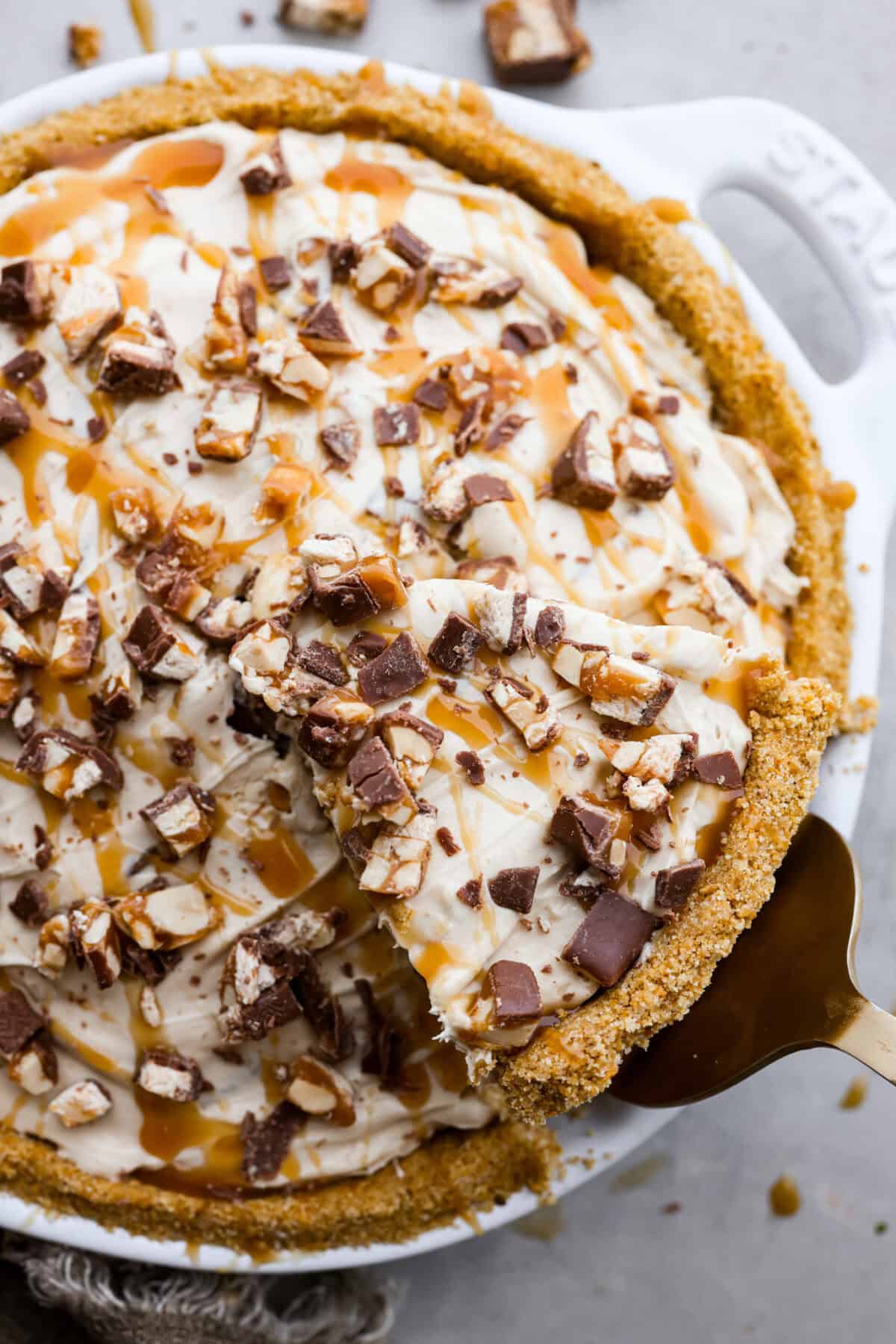 A top view of no bake snickers bar pie. 