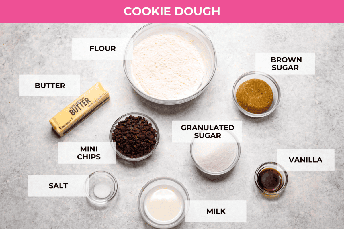 Overhead shot of the different ingredients used to make the cookie dough. each ingredient is in glass bowls of varying sizes, each with a word labeling what is in the bowls. 