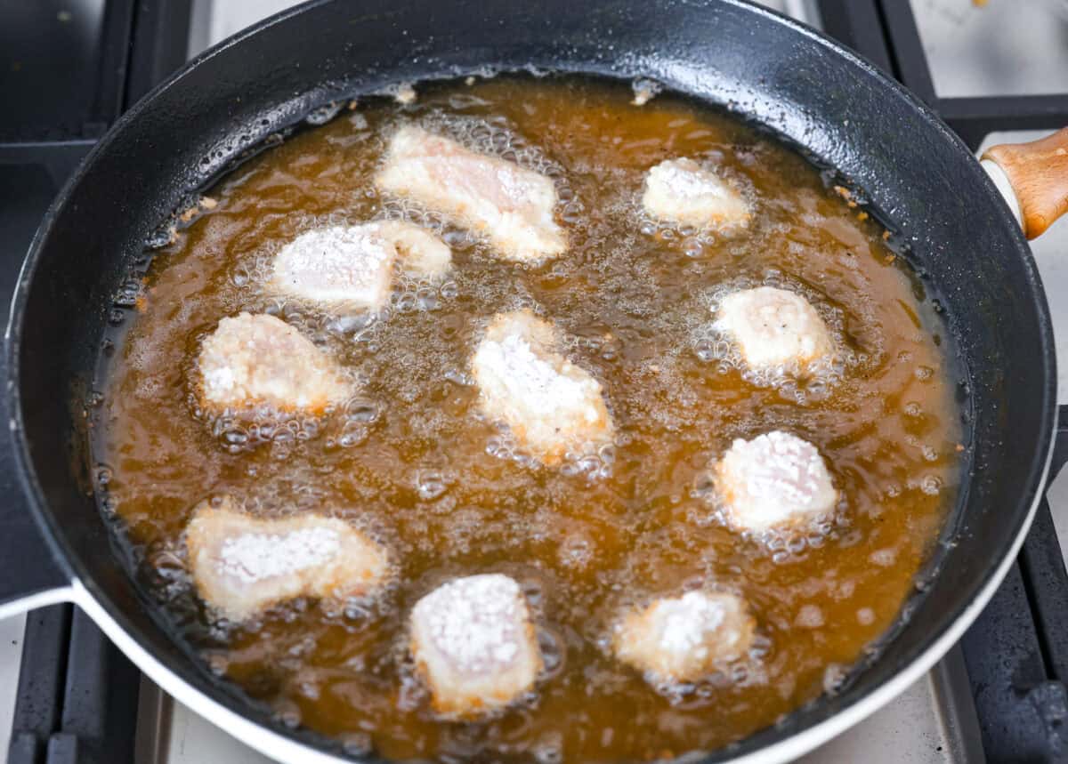 Chick fil a nuggets being cooked in oil. 