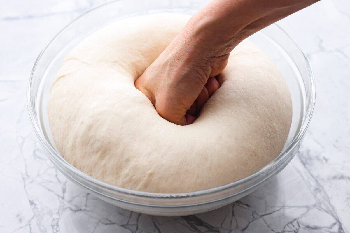 Fourth photo of punching the dough.