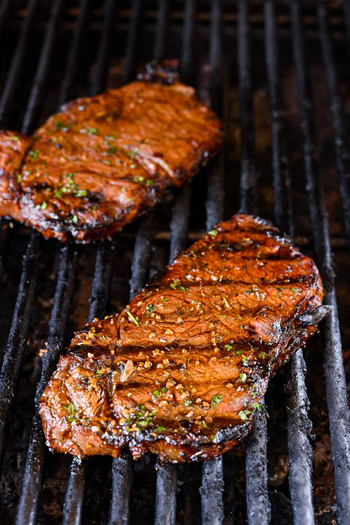 Close view of a grilled steak on the grill.