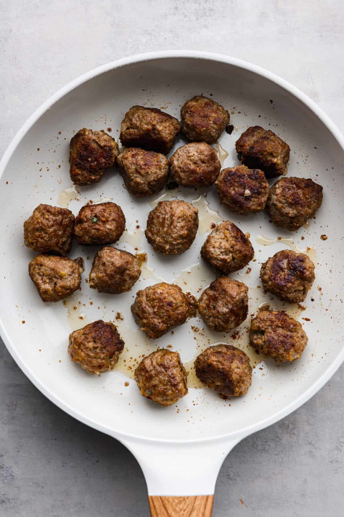 The top view of Swedish meatballs cooked in a pan, without the sauce. 